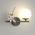 Applique murale astronaute qui pêche une boule lumineuse