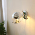 Applique murale globe en verre transparent et métal