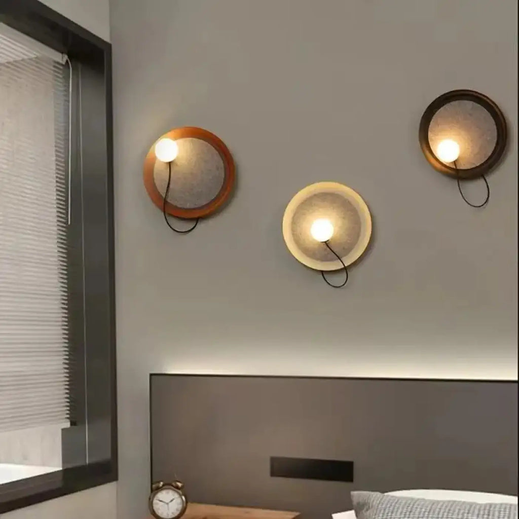 Applique murale cercle lumineux effet éclipse, trois coloris