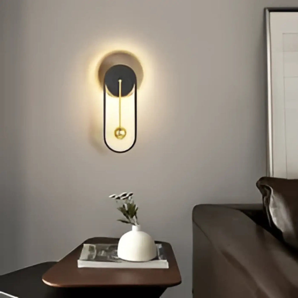 Applique murale à halo lumineux et sphère suspendue
