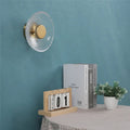 Applique disque en verre texturé avec halo lumineux