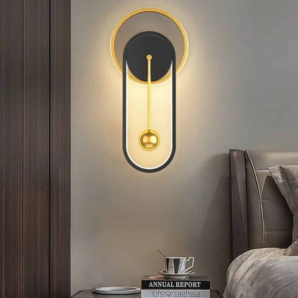 Applique murale à halo lumineux et sphère suspendue