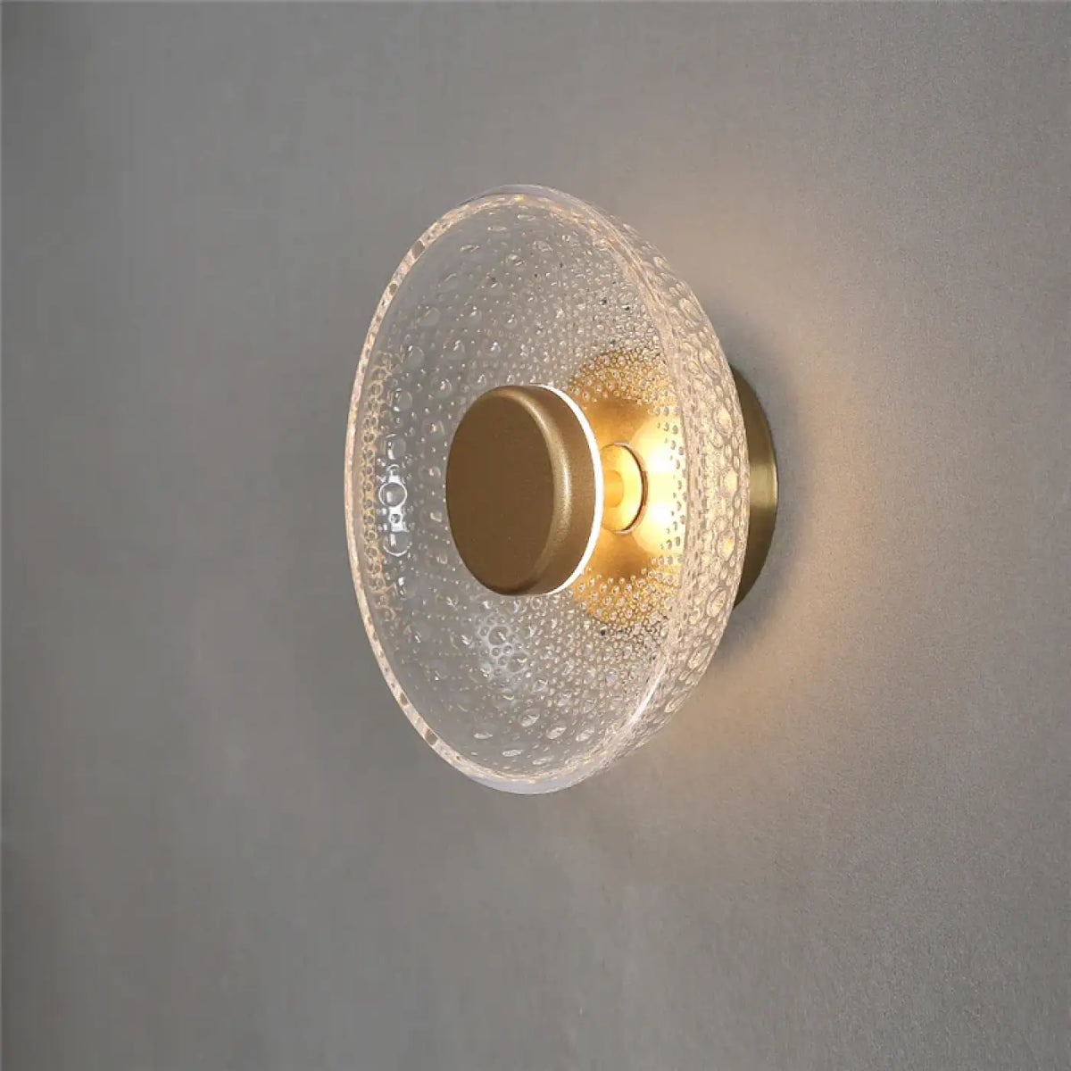 Applique disque en verre texturé avec halo lumineux