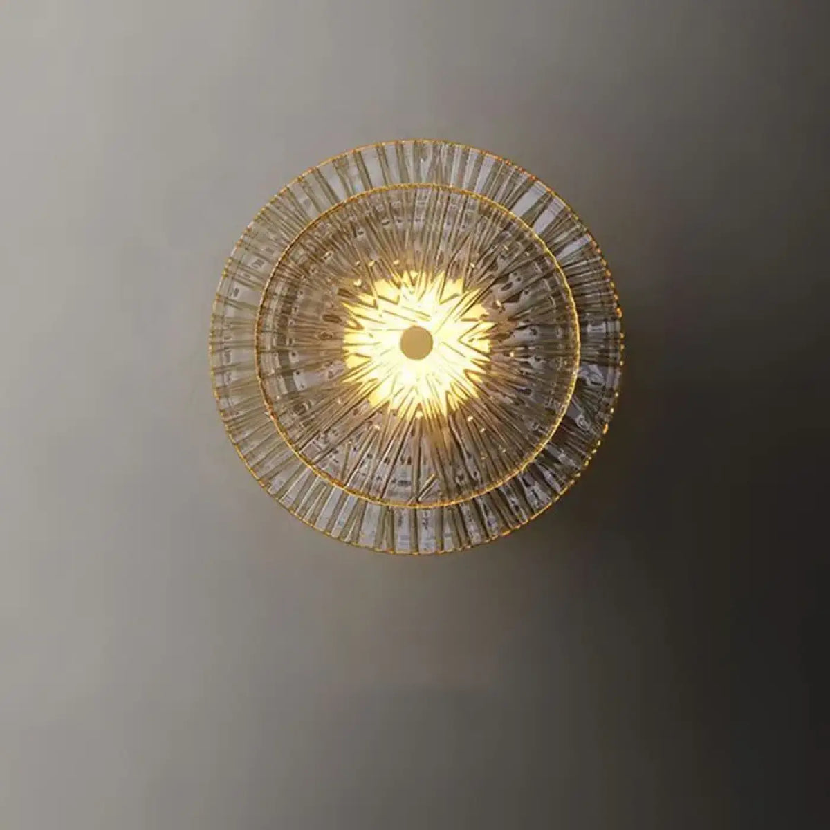 Applique murale ronde en verre et métal doré