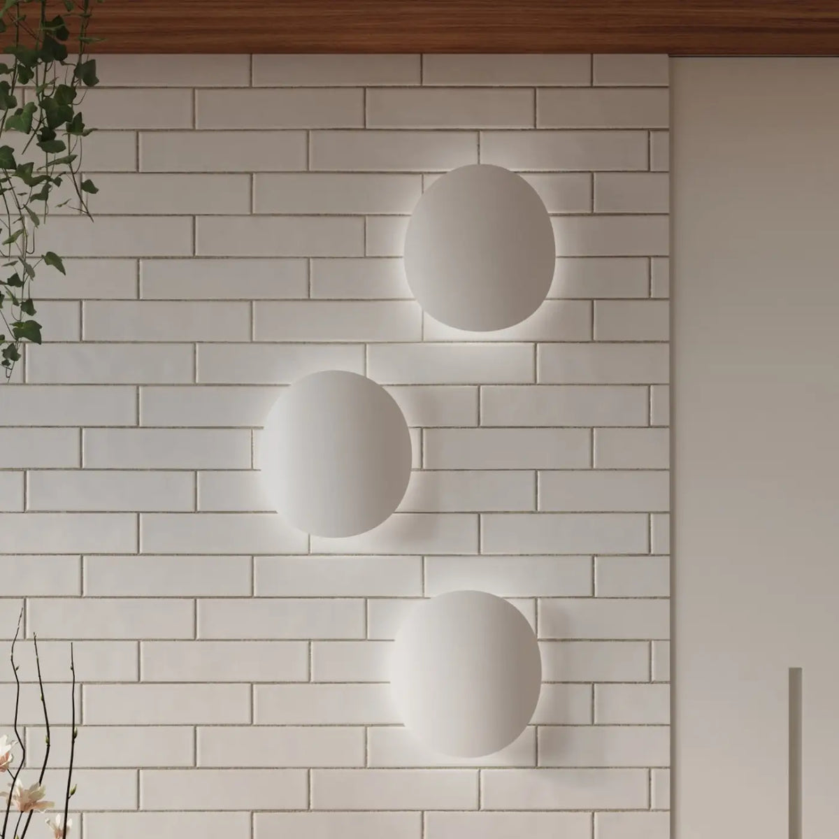 Applique murale galet en acier à halo indirect, blanc ou noir