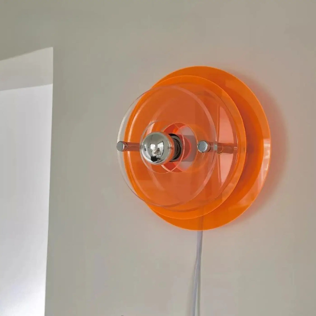 Applique murale rétro futuriste à disques en acrylique teinté, orange