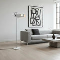 Lampadaire moderne à structure fine et lumière dirigée, blanc