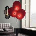 Lampadaire rouge à disques texturés et touches dorées
