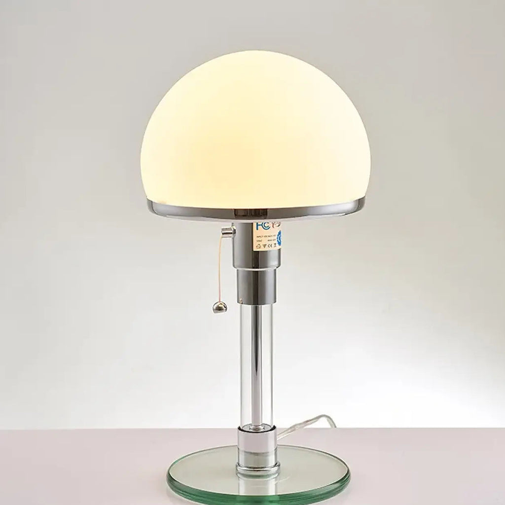 Lampe de table en verre transparent sur pied chromé