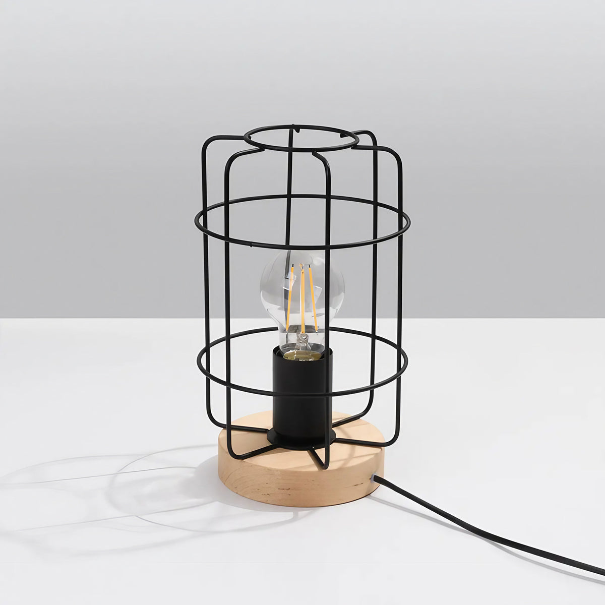 Lampe de table cage en acier noir sur socle en bois