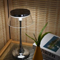 Lampe de table à base chromée et abat-jour transparent, noir