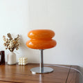 Lampe à poser en verre sur pied chromé, quatre coloris, orange