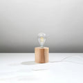 Lampe à poser socle cylindre en bois ou béton, ampoule nue, bois naturel