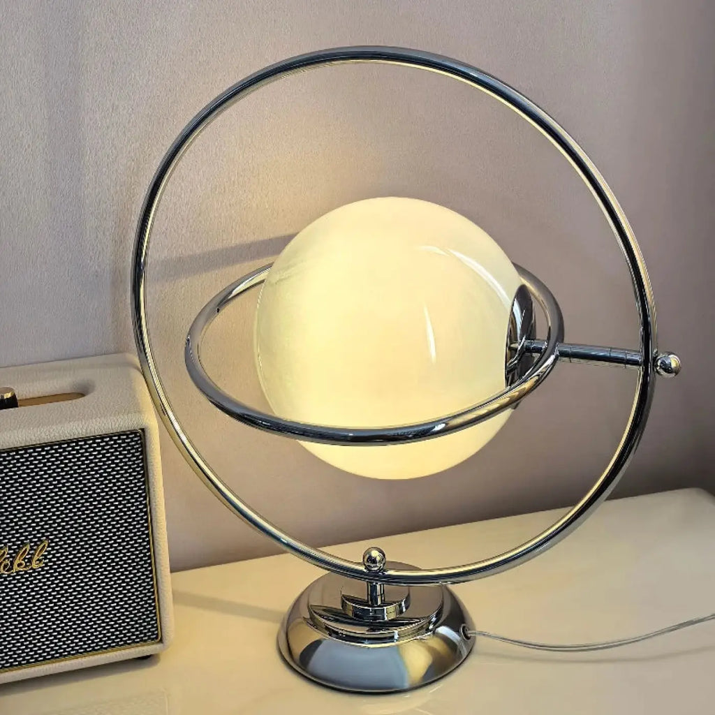 Lampe à poser effet planète sur base métallique
