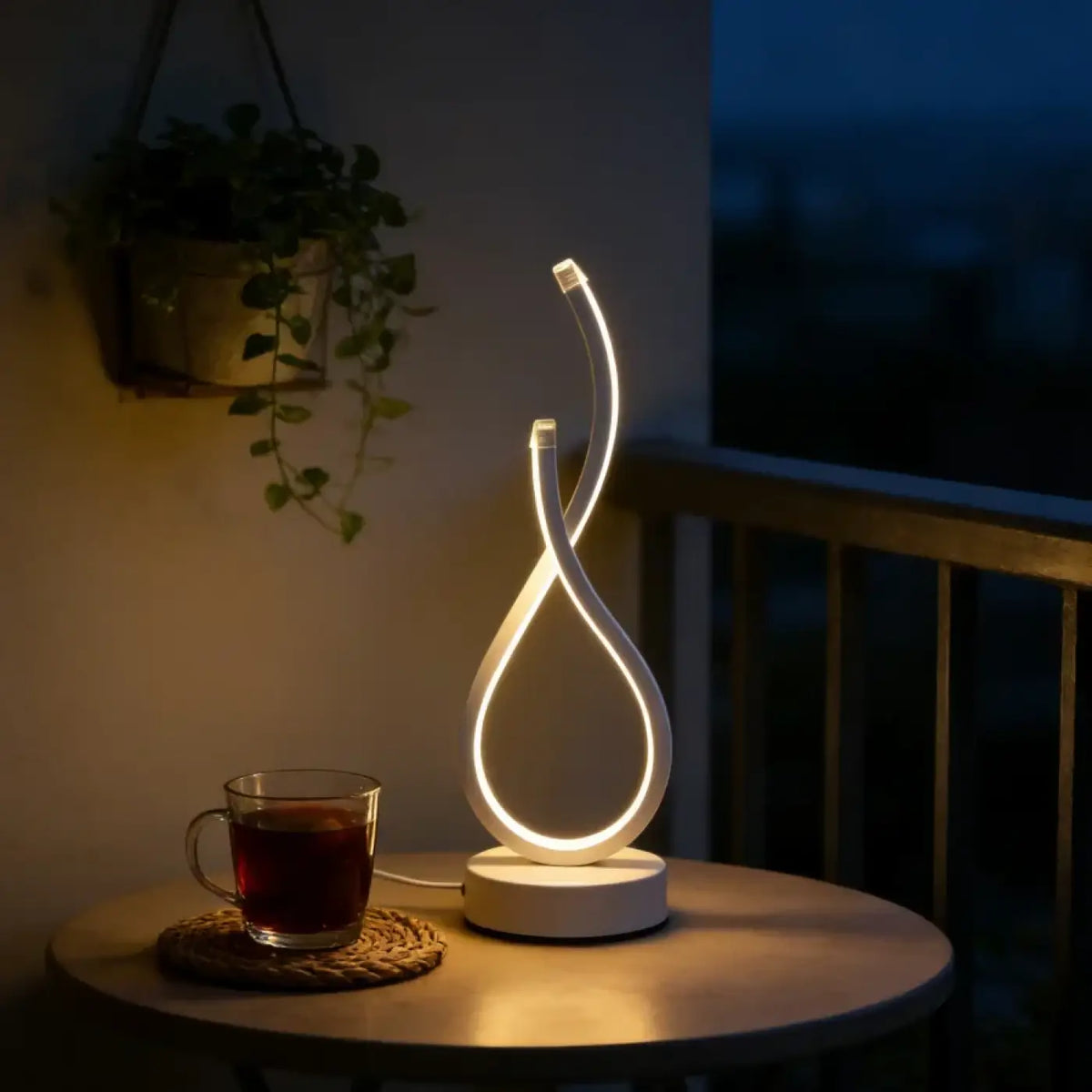 Lampe à poser en boucle lumineuse, ligne sculpturale