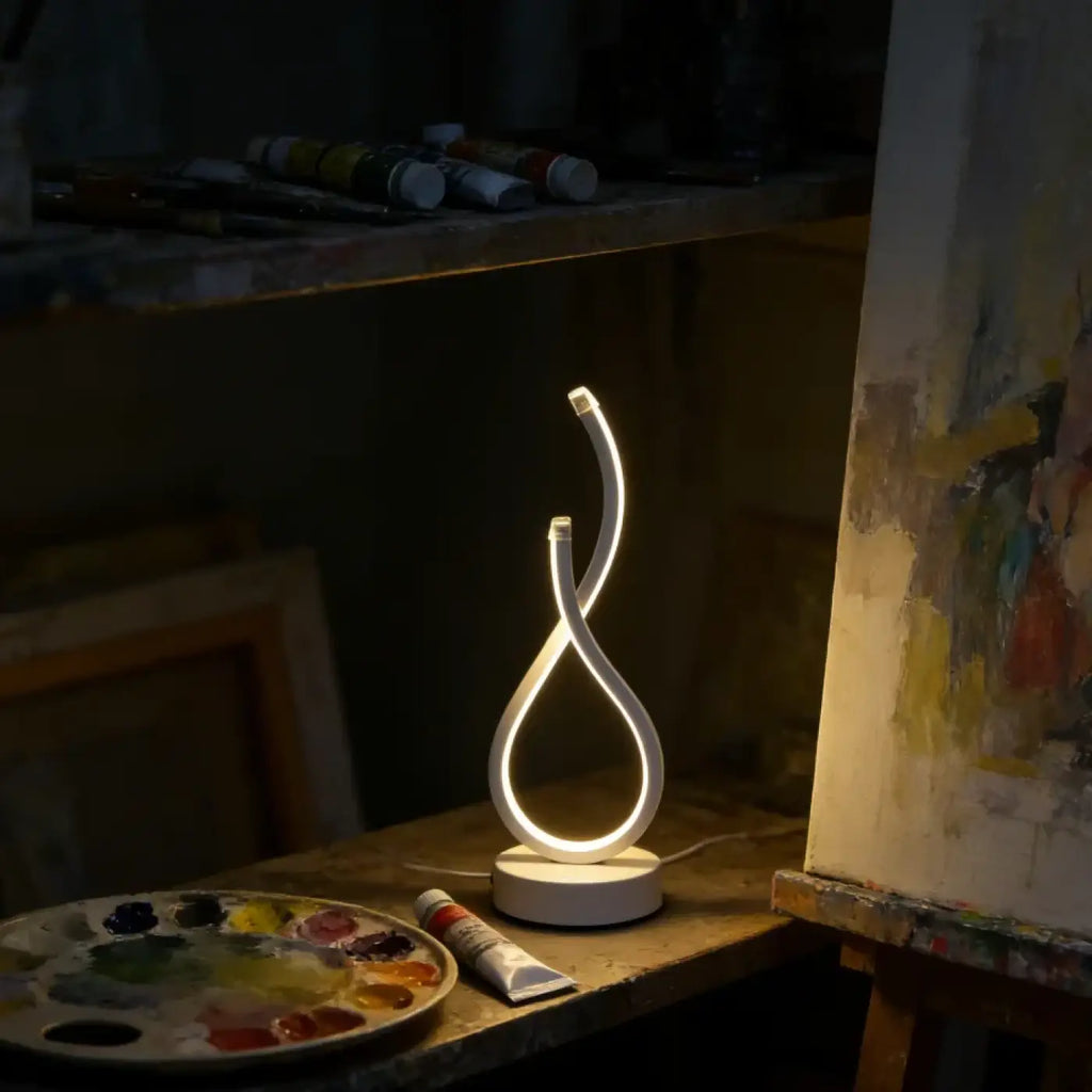Lampe à poser en boucle lumineuse, ligne sculpturale