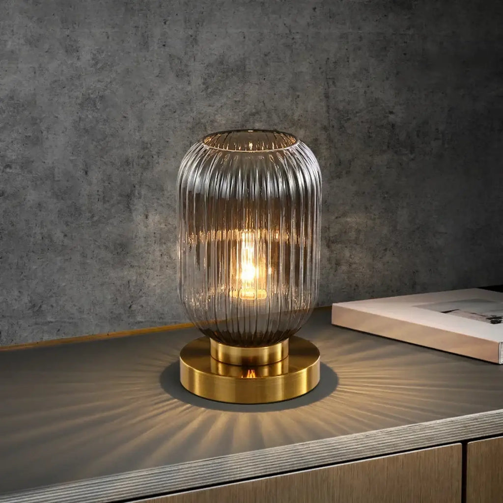 Lampe de table en verre sur base dorée, deux tailles