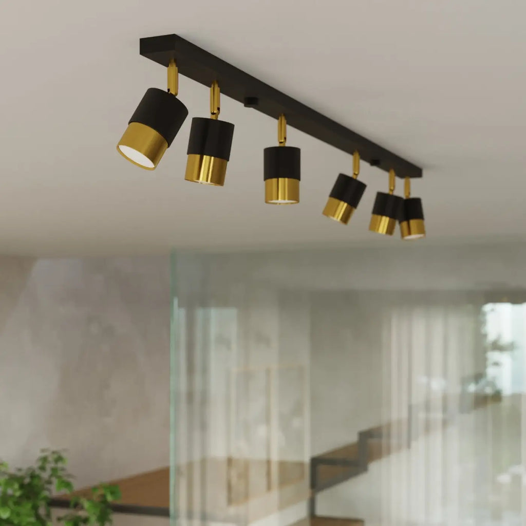 Plafonnier barre 4 spots orientables noir à bagues dorées, 81 cm