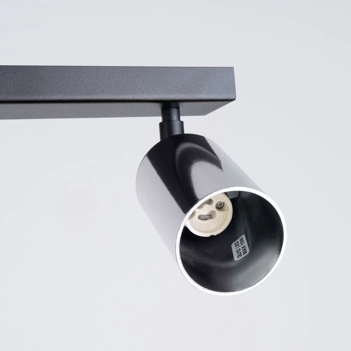 Plafonnier 4 spots orientables noir et chrome, rampe de 82 cm