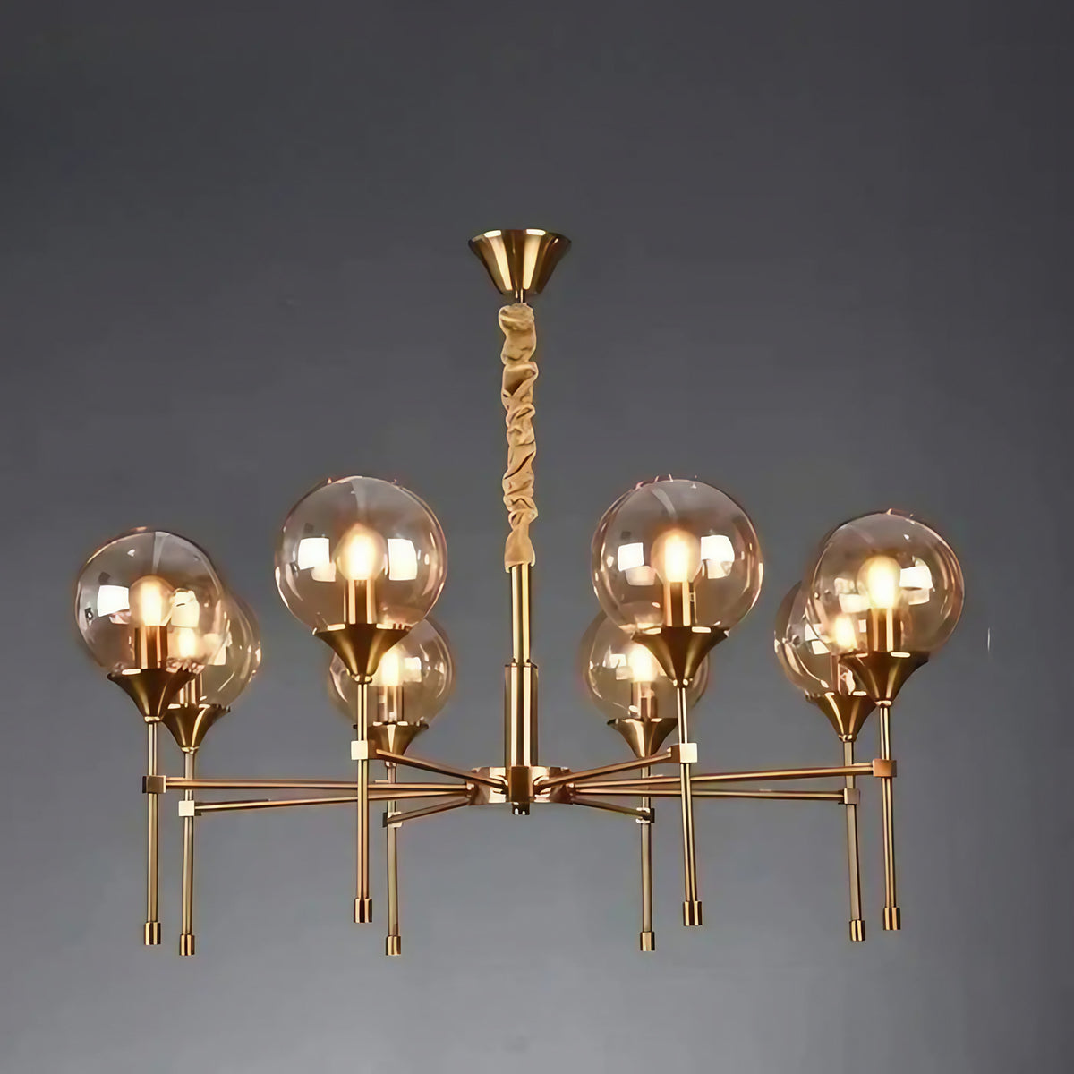 Suspension en métal doré et sphères de verre fumé, trois modèles, ambre