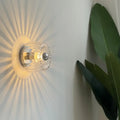 Petite applique murale soleil en verre doré