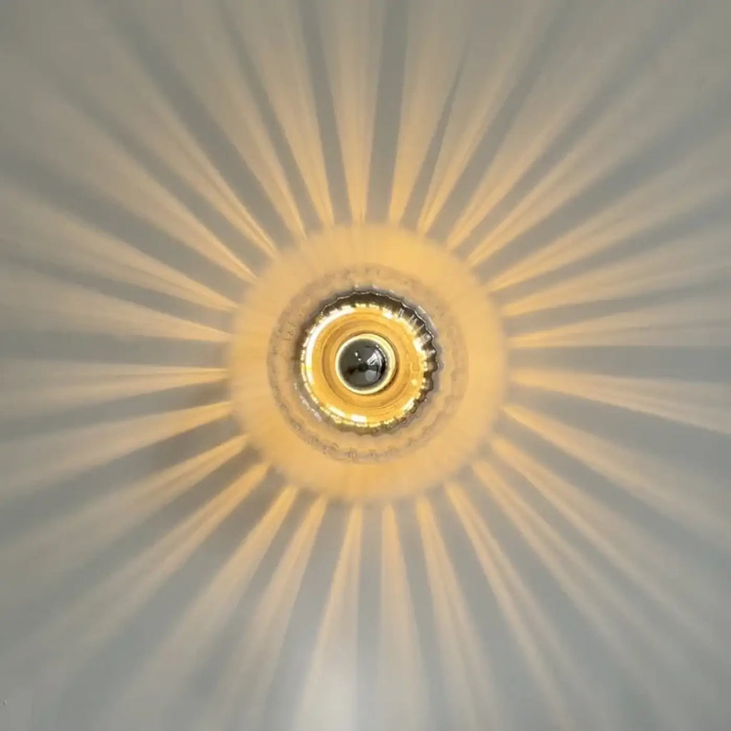 Petite applique murale soleil en verre doré