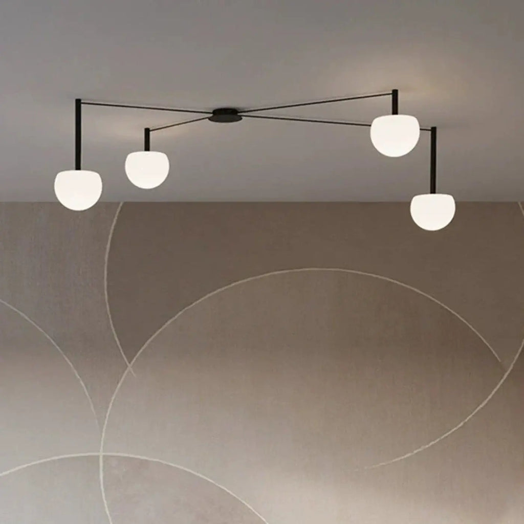 Suspension à branches noires et globes en verre opalin