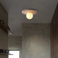 Plafonnier en pierre claire et globe de verre blanc