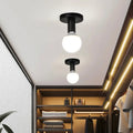 Plafonnier minimaliste noir avec ampoule globe apparente