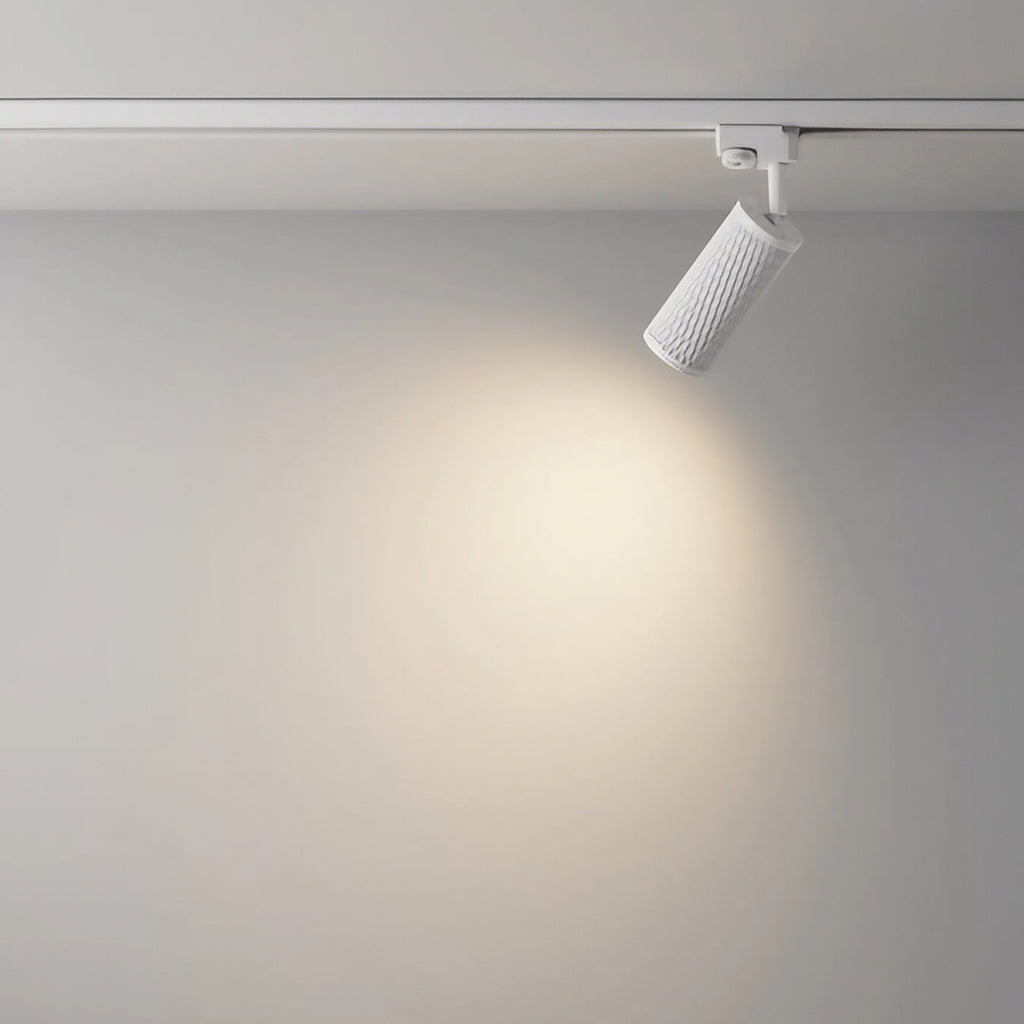 Spot orientable à tête texturée en acier, noir, blanc ou doré
