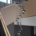 Suspension cascade de boules noires, tailles S à XL