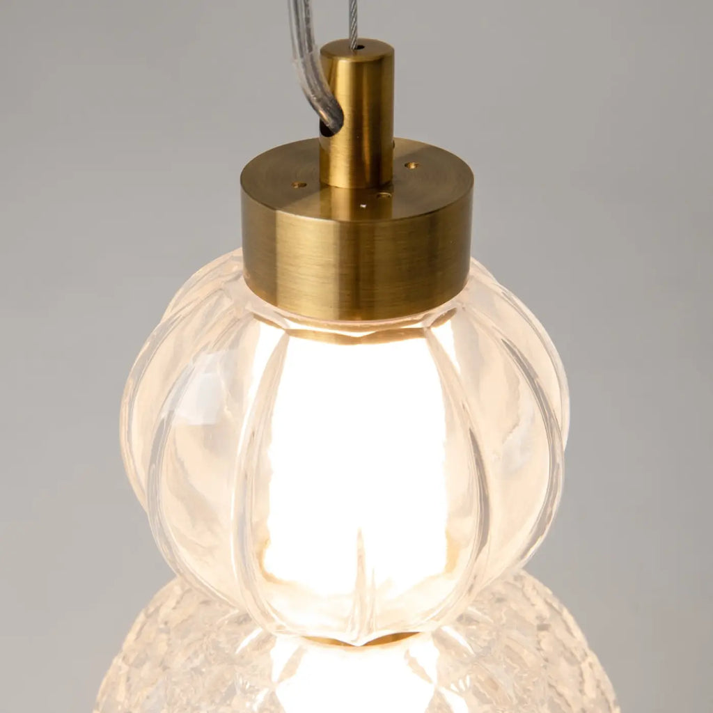 Petite suspension LED globe de verre, col en métal doré