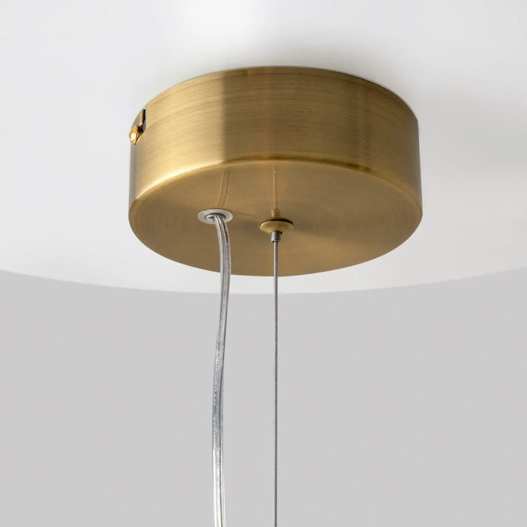 Petite suspension LED globe de verre, col en métal doré