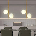 Suspension deux globes en opaline sur métal doré, tailles S et M