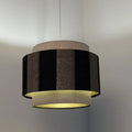 Suspension double cylindre beige, noir et doré, en tissu