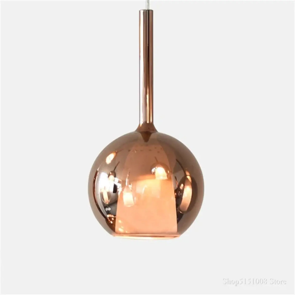 Suspension boule en verre teinté, quatre teintes dont or rose, or rose