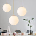 Suspension grosse boule blanche, coloris doré ou noir, doré
