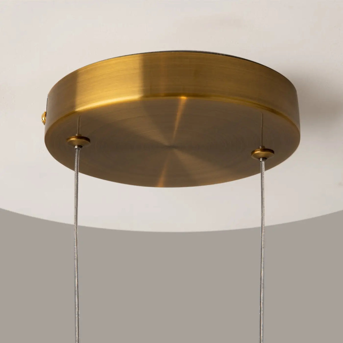 Suspension LED disque doré et globe en verre, effet éclipse