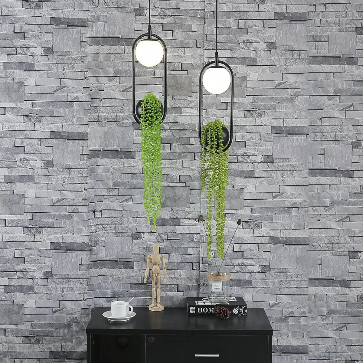 Suspension anneau noir avec feuillage artificiel et globe LED