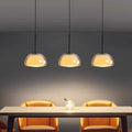 Suspension à barre noire et trois lampes en verre opalin