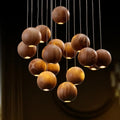 Suspension sphères en bois naturel, quatre tailles S à XL