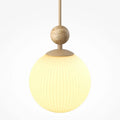Suspension globe en verre sur base en pierre travertin