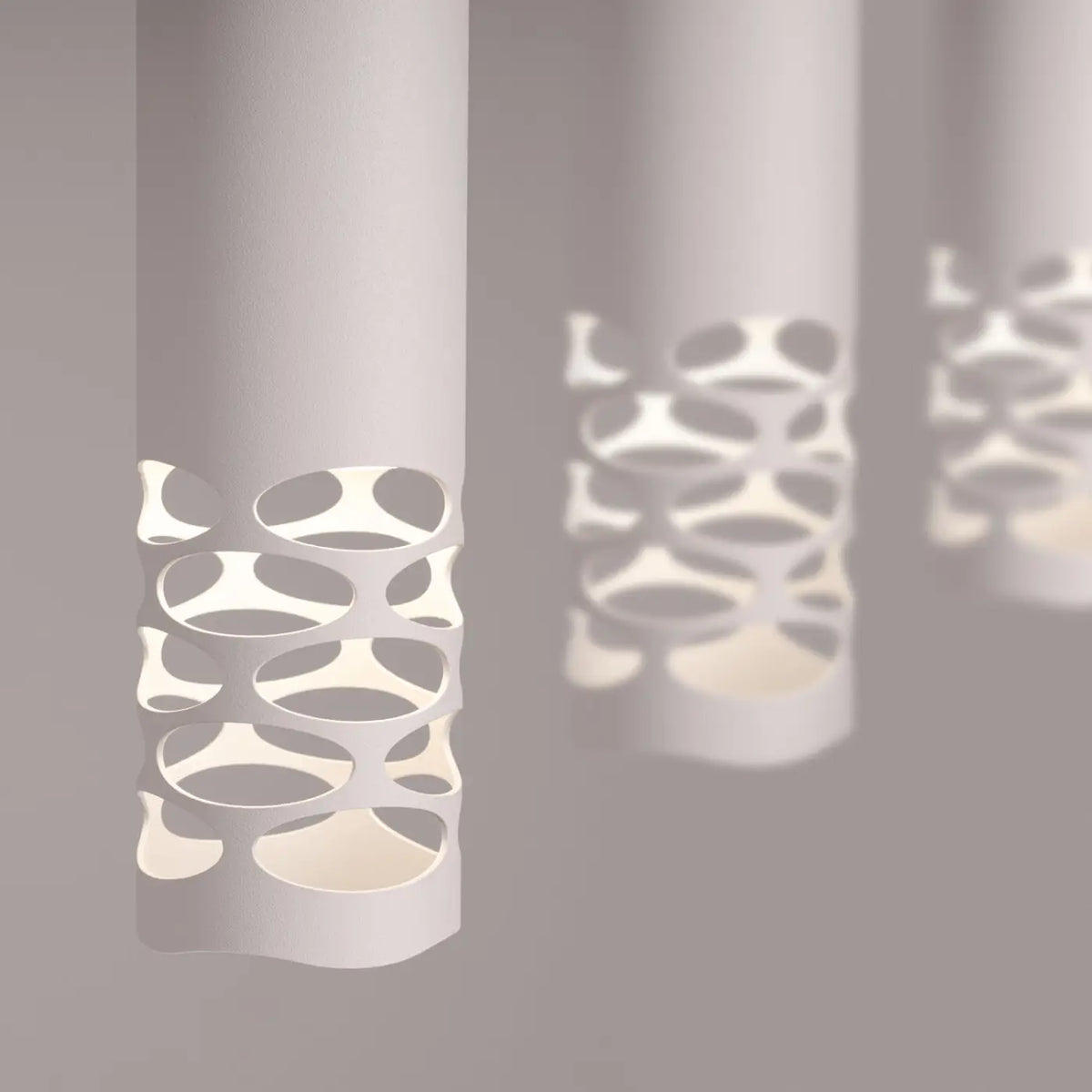 Suspension tube en acier blanc, bas ajouré d'ovales, GU10